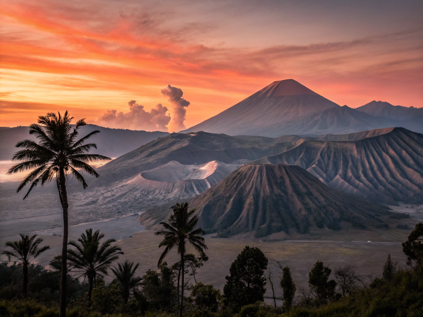 Mount Merapi volcano cone shrouded in misty dawn clouds across Central Java